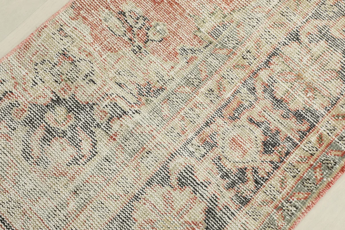 Overhead view showcasing the overall distressed look and color variation across the rug's surface