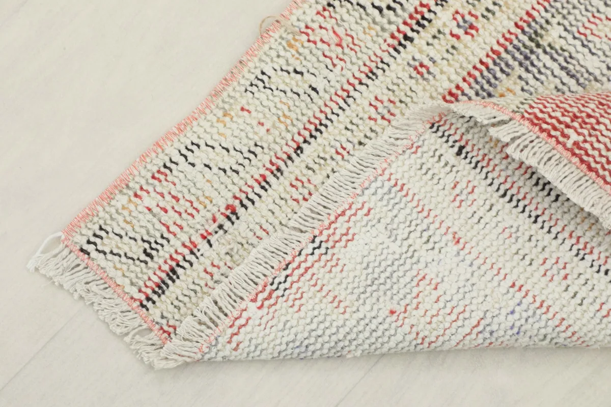 View of the back of the rug, revealing the cotton foundation and tight hand-knotting.