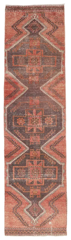 Full top view of the 2'9" x 10'6" rust and brown geometric Anatolian runner rug on a white background.