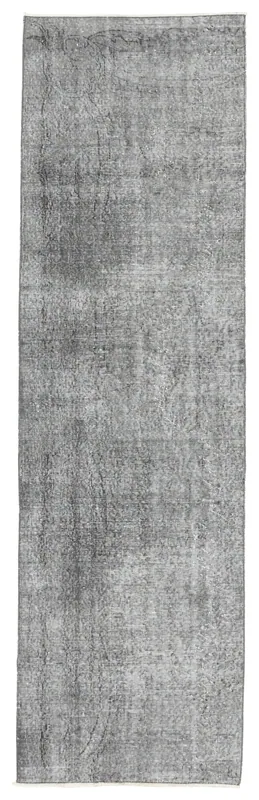 Full overhead view of the charcoal gray vintage runner rug on a white background