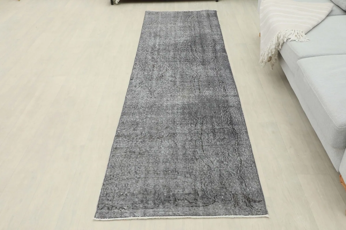 Full view of the runner rug in a room, showing its placement relative to furniture
