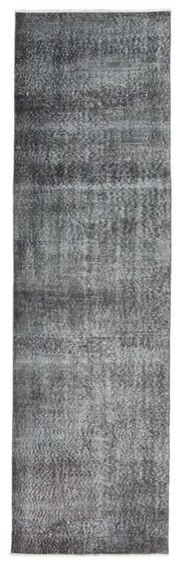 Full top view of the charcoal and gray vintage Anatolian runner rug on a white background.