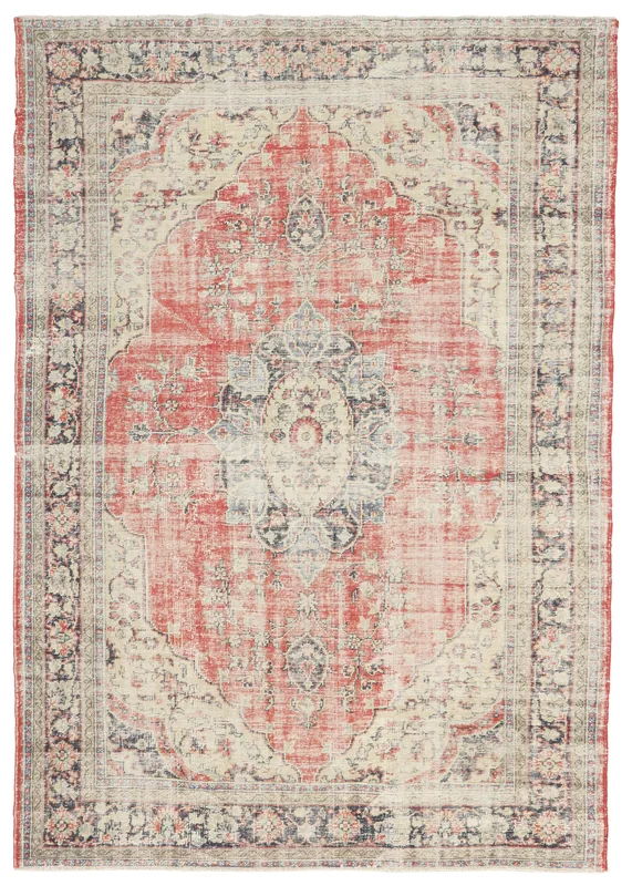 Full top view of the vintage red and cream Anatolian area rug with a central medallion.