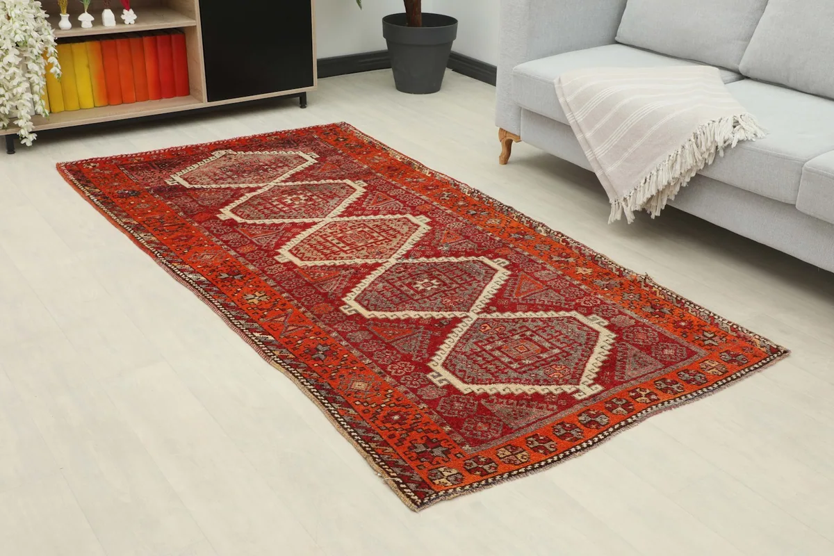 Angle view of the geometric Anatolian rug in a contemporary room with a sofa