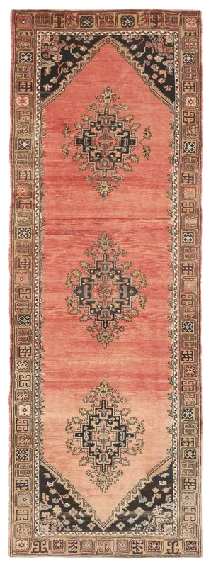 Full overhead view of the vintage rose runner rug with black and tan geometric medallions