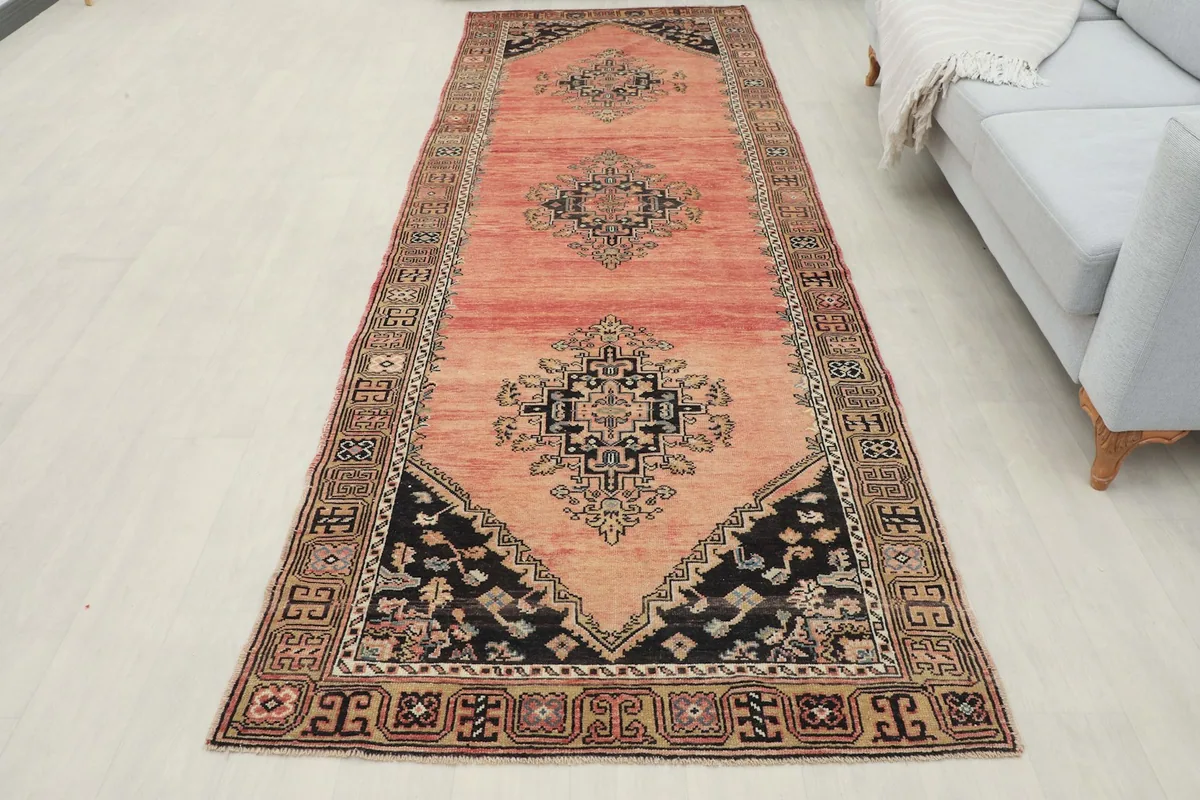 Full overhead view of the runner in a room, showcasing its length and vibrant rose color