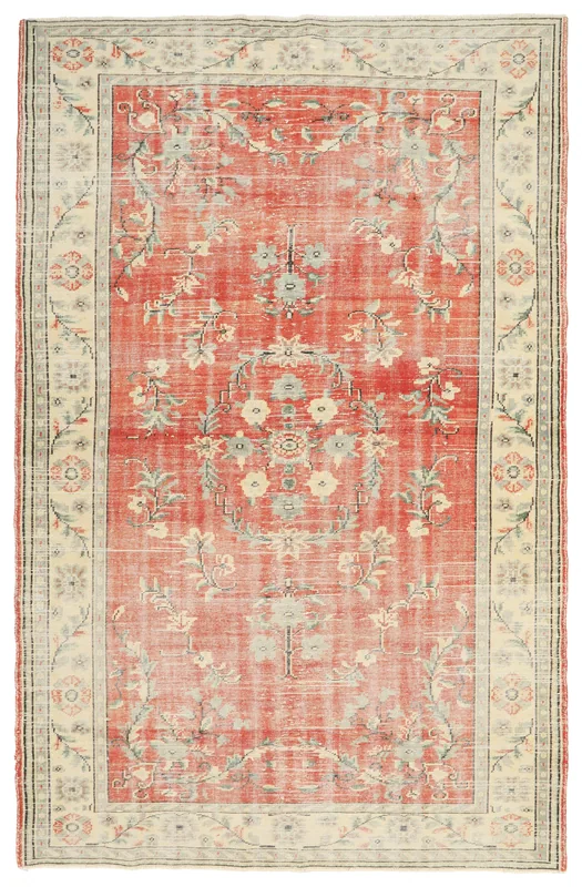 Full overhead view of the vintage rust floral medallion rug on a white background