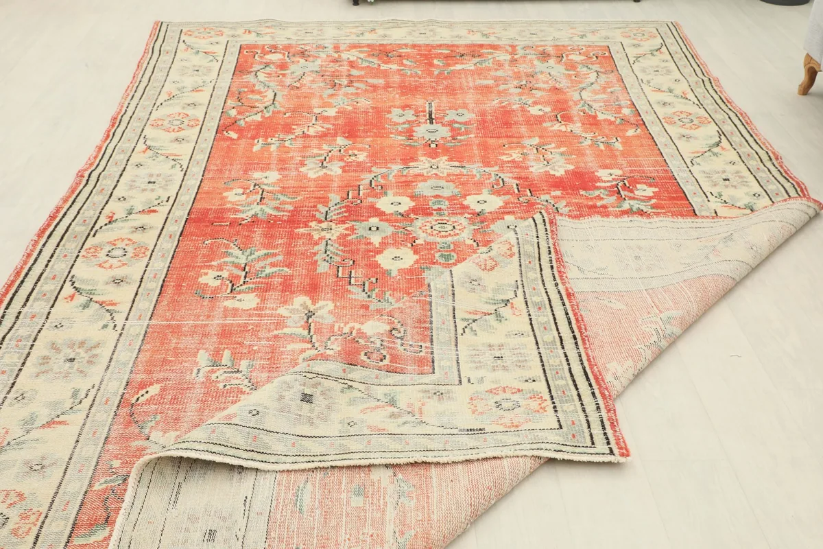 Larger section of the rug folded to illustrate the flexibility and quality of the vintage textile