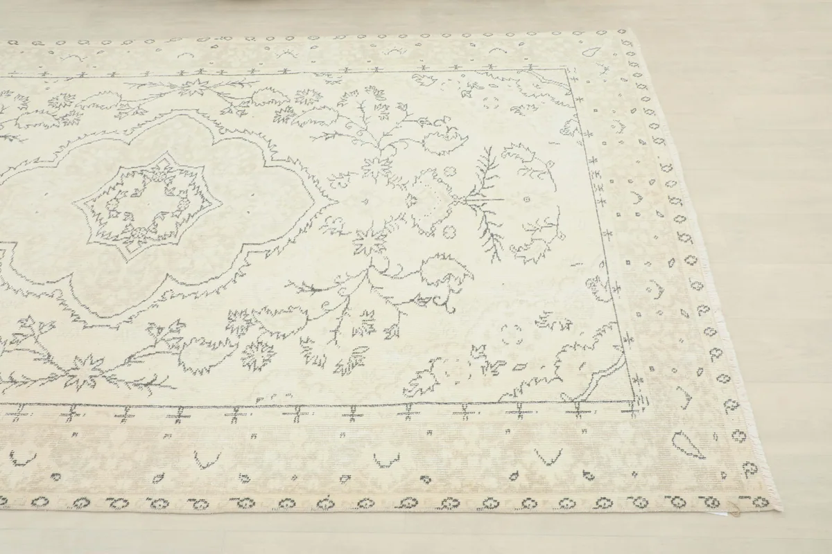 Close-up of the Ivory Medallion Anatolian Rug's corner, highlighting the border and field patterns.
