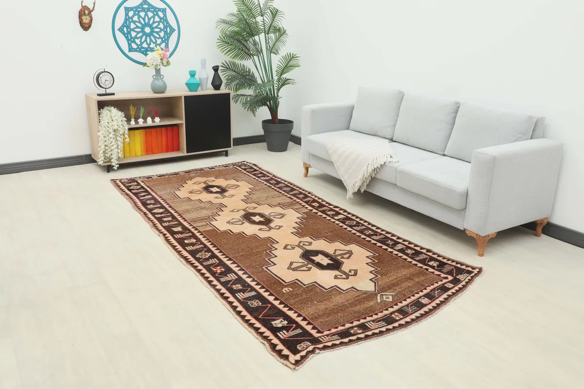 Beige Brown Tribal Anatolian Rug displayed in a modern living room setting.