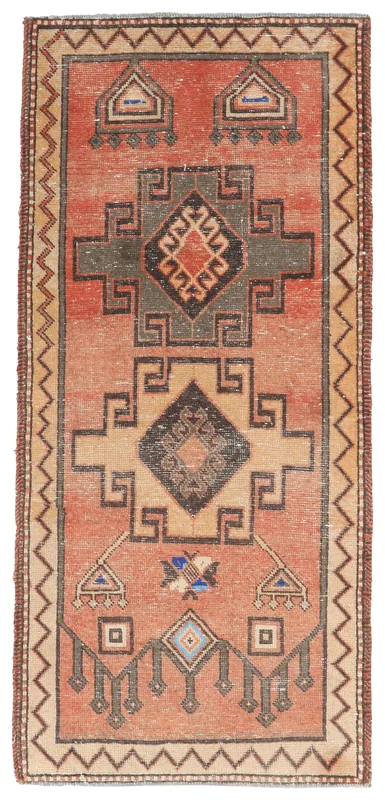 Top view of a small rust and charcoal geometric vintage Anatolian area rug