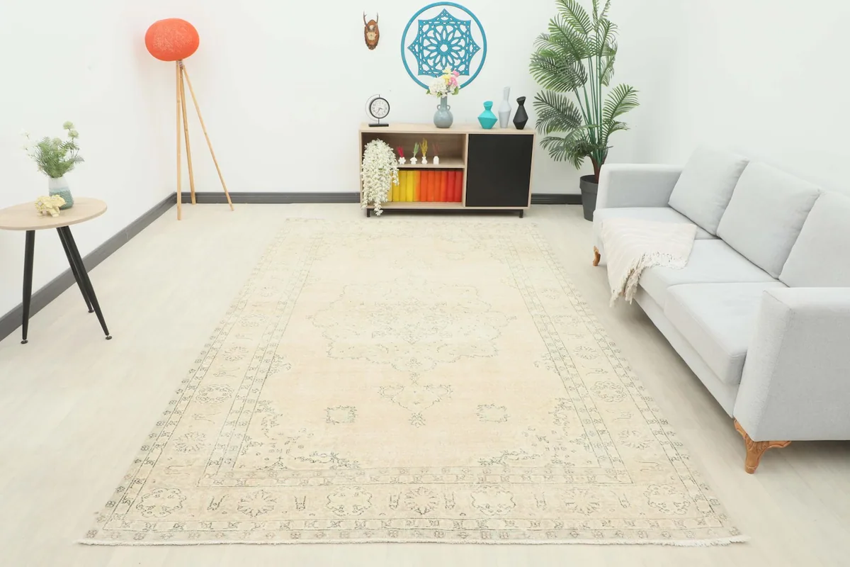 Full room view of the beige and gray vintage rug, showing its scale and how it complements the decor.