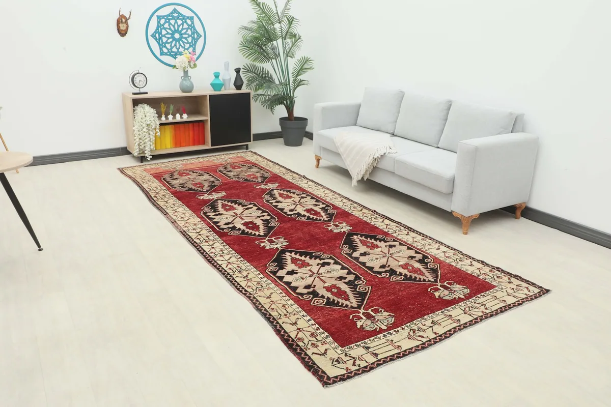 Runner rug displayed in a living room setting with a sofa and cabinet