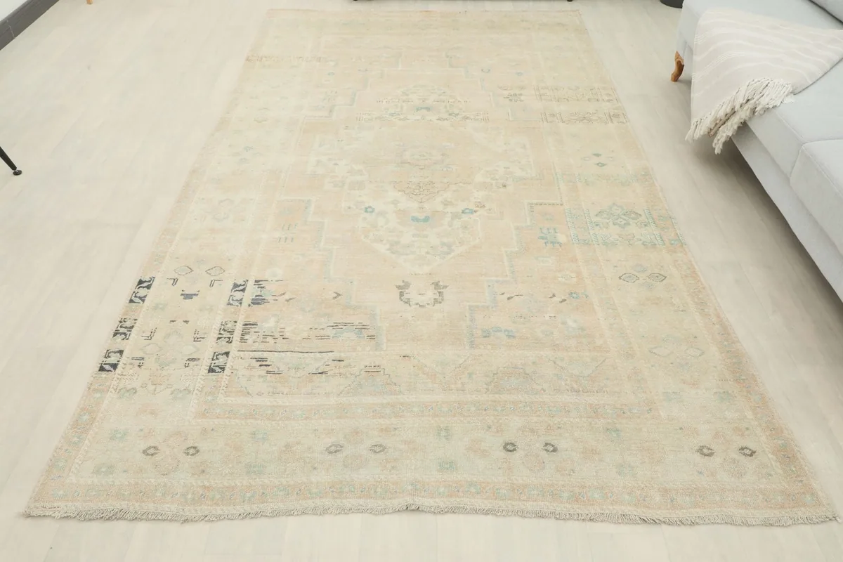Full overhead view of the vintage Anatolian rug, displaying its entire design and color variations
