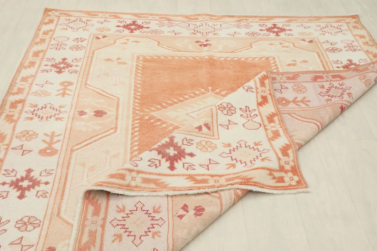 View showing the back of the hand-knotted rug and its cotton foundation