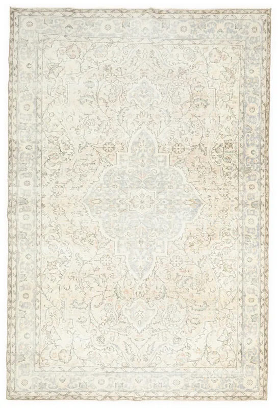 Full overhead view of the vintage cream and blue medallion area rug