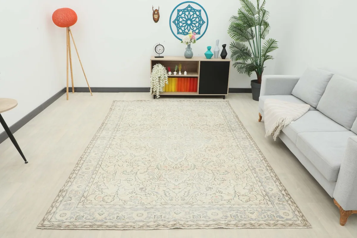 Overhead view of the rug in a living room from a wider perspective, showcasing its size