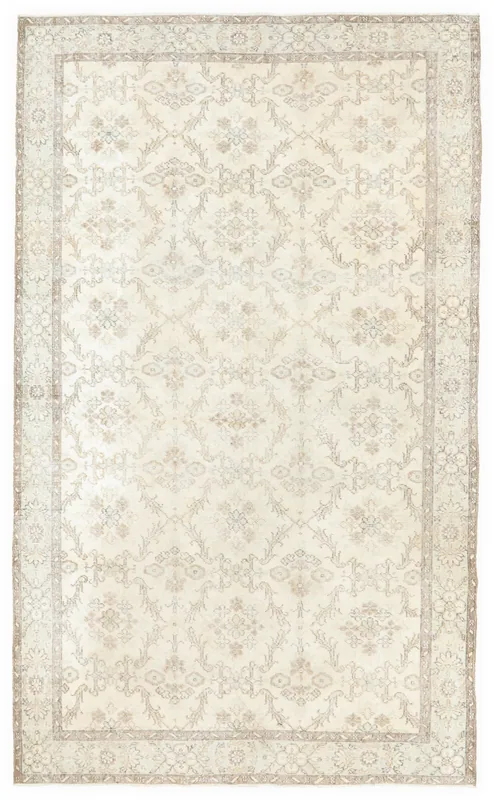 Full overhead view of the hand-knotted vintage Anatolian rug with ivory and tan patterns