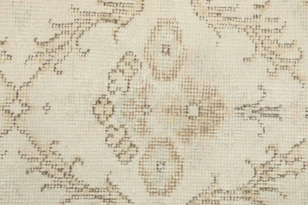 Close-up of the hand-knotted wool pile, showing individual knots and color variations