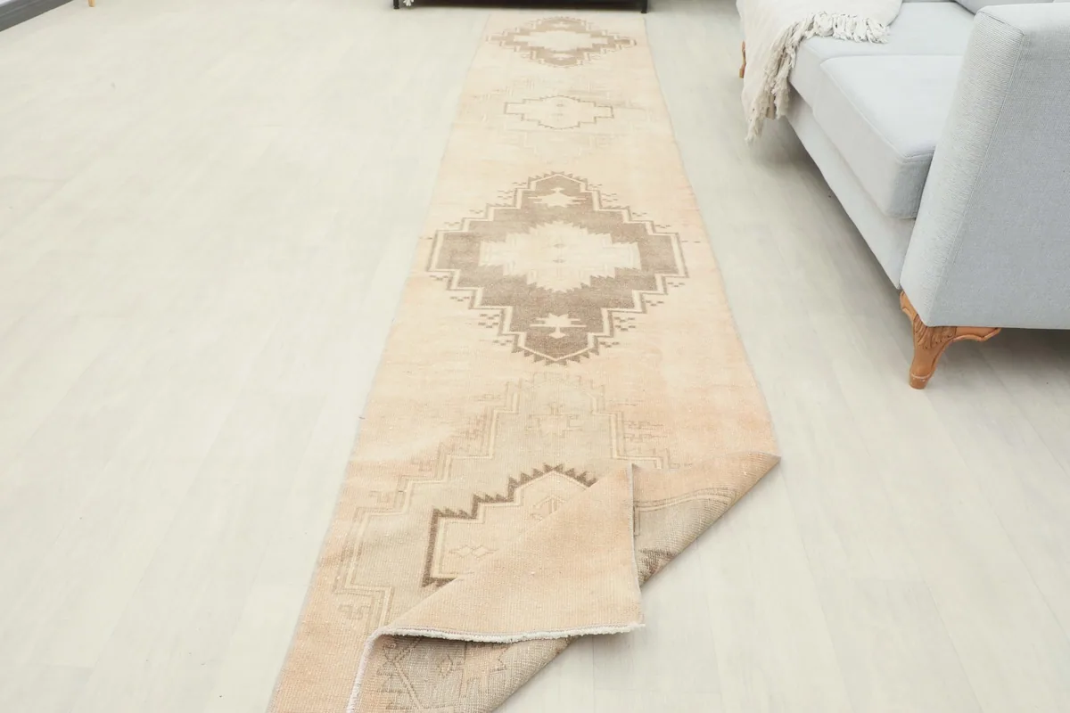 Angled view of the runner in a room, with one end slightly folded to show flexibility.