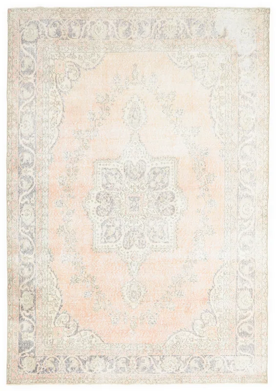 Top view of the 6'9" x 10'0" vintage Anatolian rug with a rose field and gray medallion on a white background.