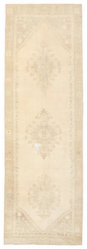 Full top view of the 3'7" x 11'2" vintage Anatolian runner with rose and cream colors