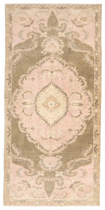 Full top view of the 4'5" x 9'5" rose and brown vintage Anatolian area rug with medallion design