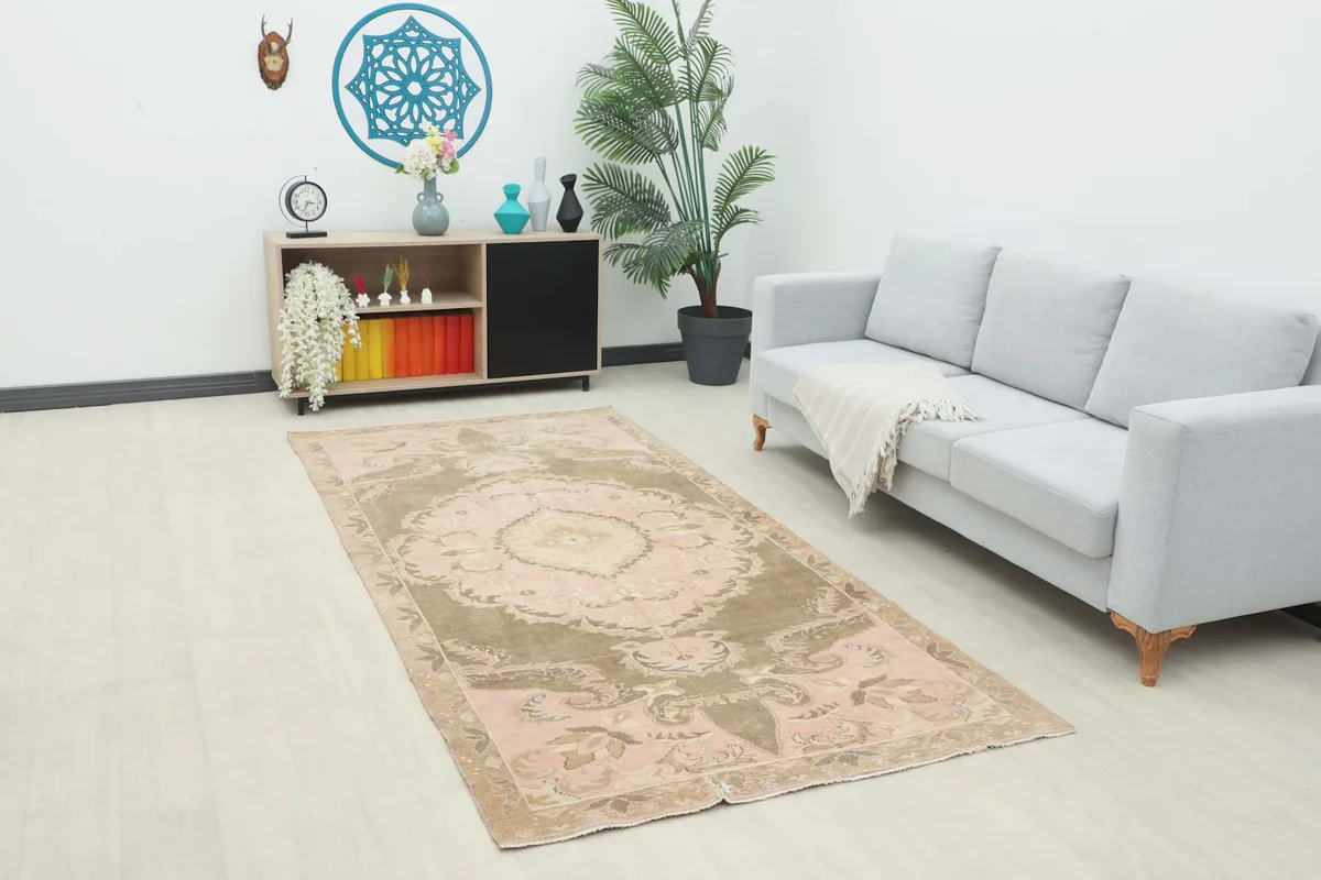 Vintage Anatolian rug displayed in a bright living space, showing its size and color in context