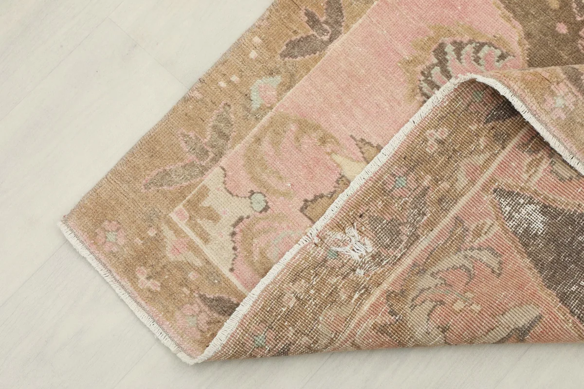 Folded section of the rug, revealing the reverse side and the quality of the vintage wool material