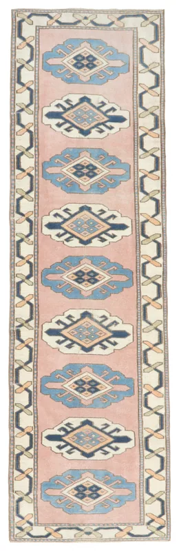 Full top view of the 2'9" x 9'10" pink and blue geometric Anatolian runner on a white background.
