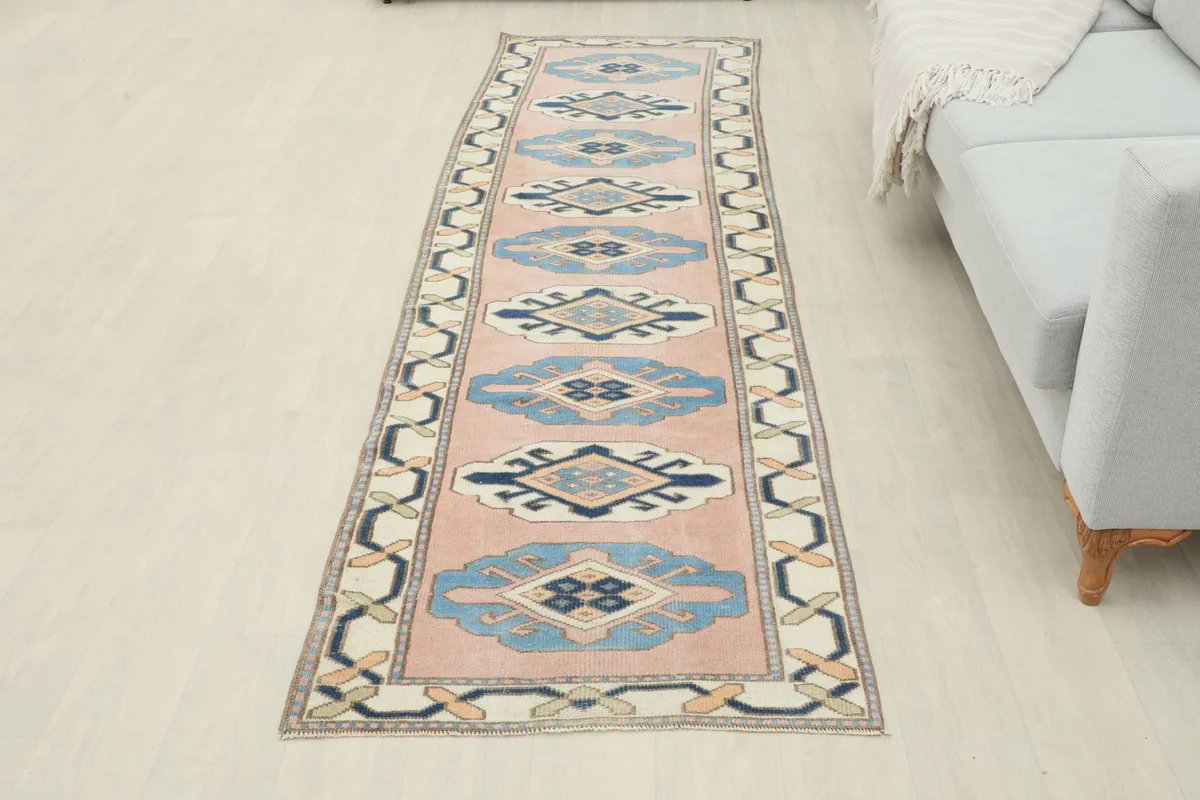 Full length view of the 2'9" x 9'10" Anatolian runner in a room setting.