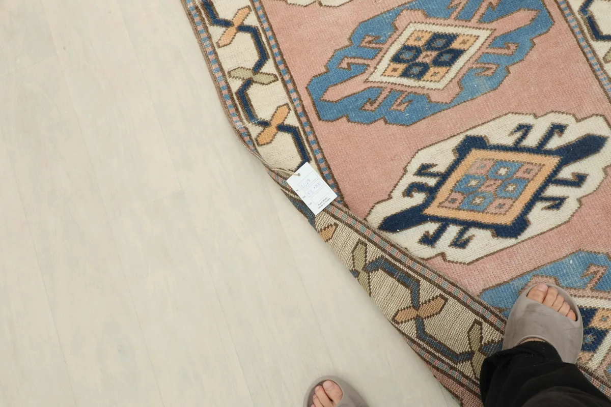 Overhead view of the runner's corner with a foot, illustrating scale and texture.