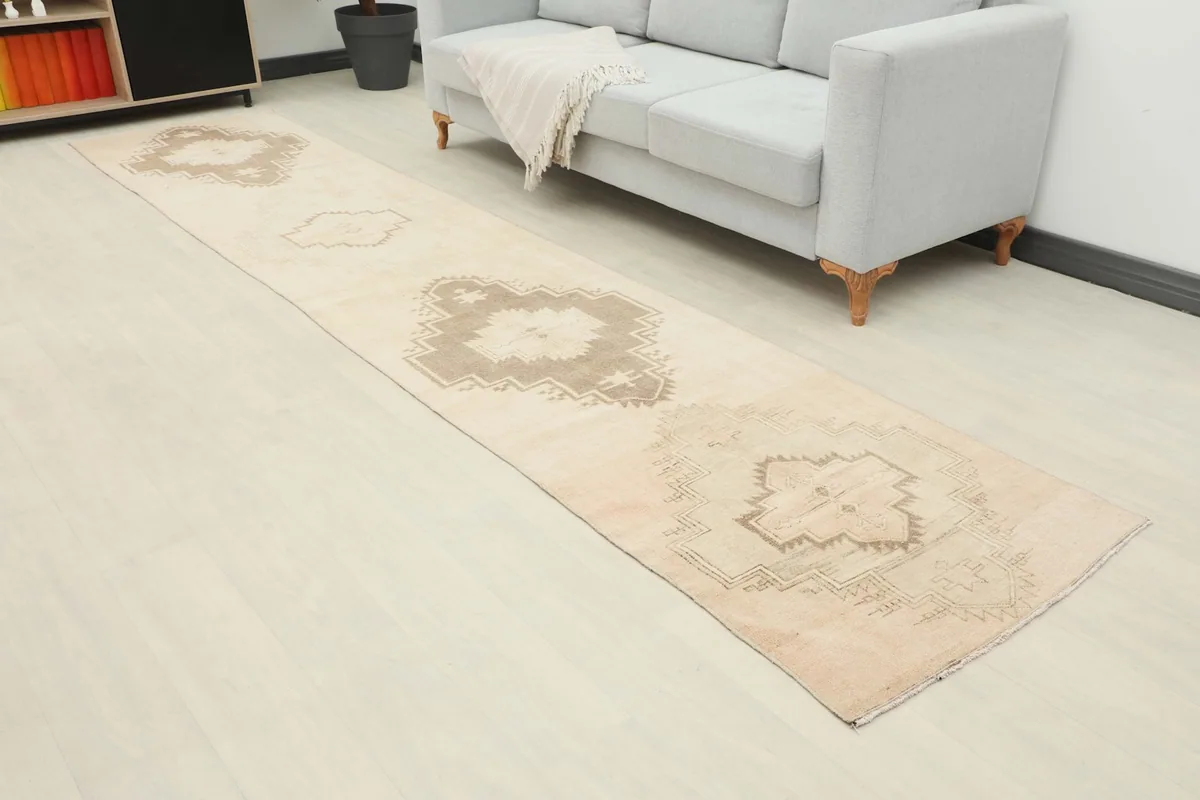 Overhead view of the runner rug extending through a room with a sofa