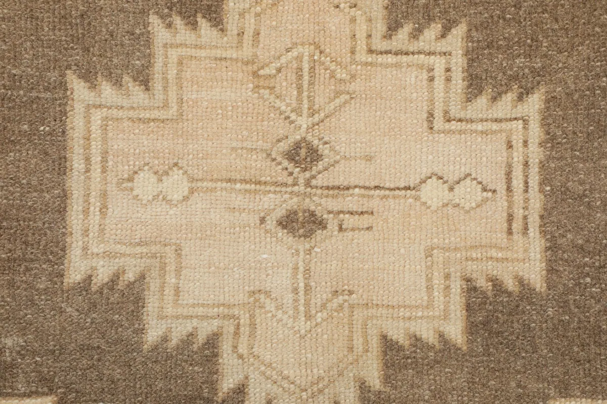 Close-up of the hand-knotted wool pile showing texture and pattern details