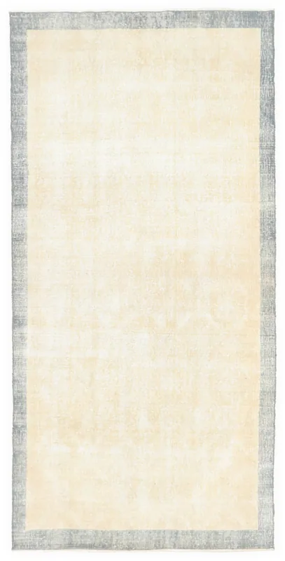 Top view of the 3'5" x 6'11" vintage Anatolian area rug with cream field and gray border