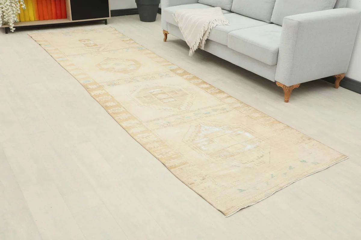 Angled view of the beige runner rug showcasing its length in a modern living space.