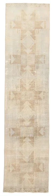 Full top view of the 2'10" x 12'6" beige geometric Anatolian runner rug on a white background