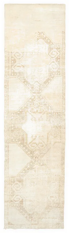 Full top view of the 2'9" x 10'9" beige vintage Anatolian runner rug with geometric patterns