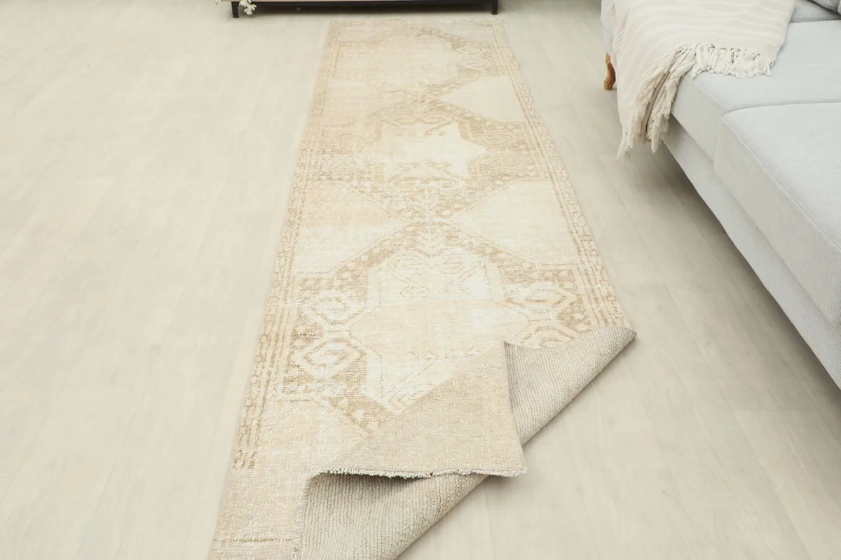 Runner rug partially unrolled in the room, showing its flexibility and full length