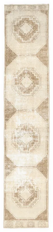 Full top view of the 2'6" x 12'6" cream and brown geometric Anatolian runner rug