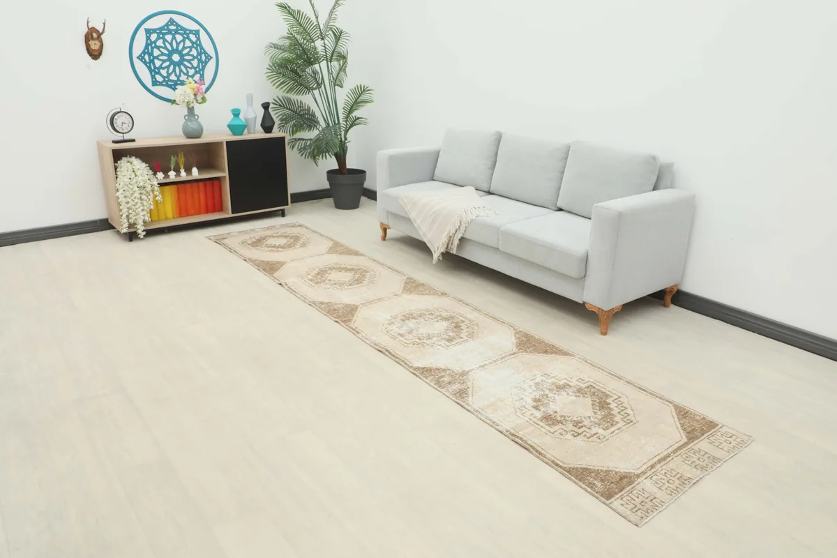 Vintage runner rug in a modern living space, extending along a light-colored floor