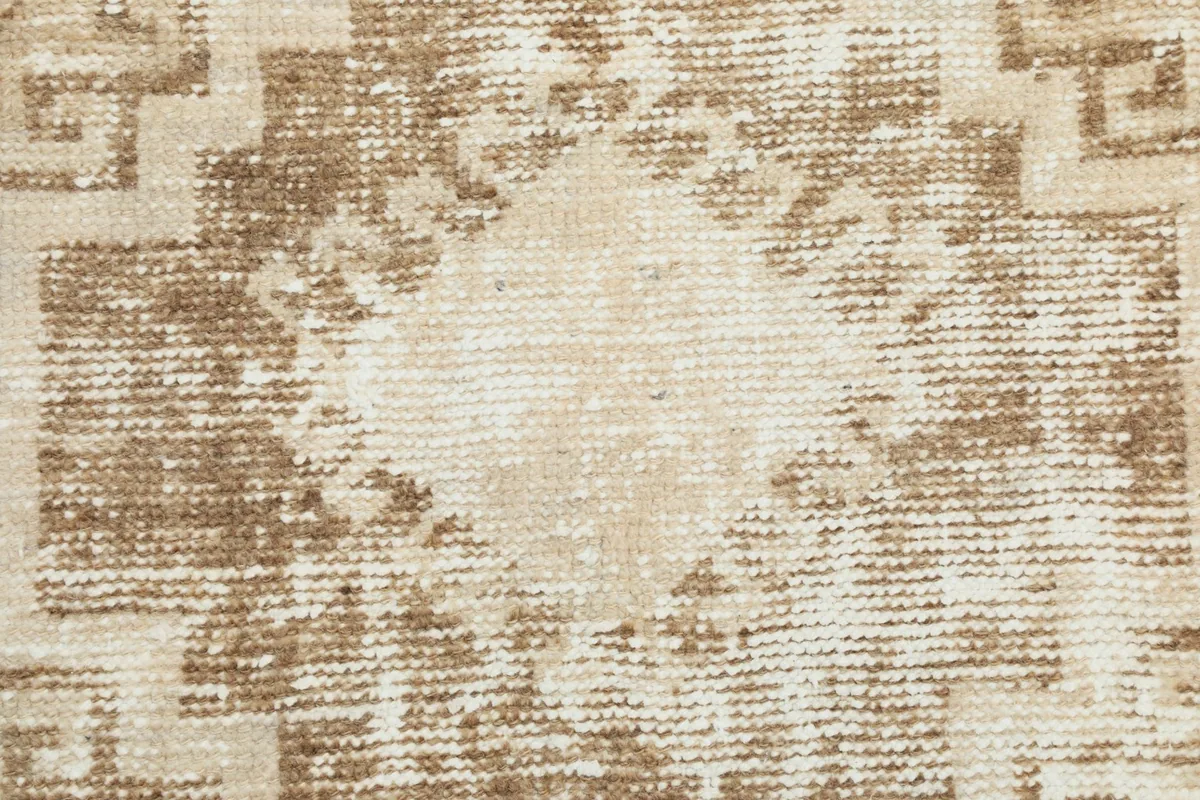 Close-up of the low wool pile, showing the hand-knotted texture and vintage wear