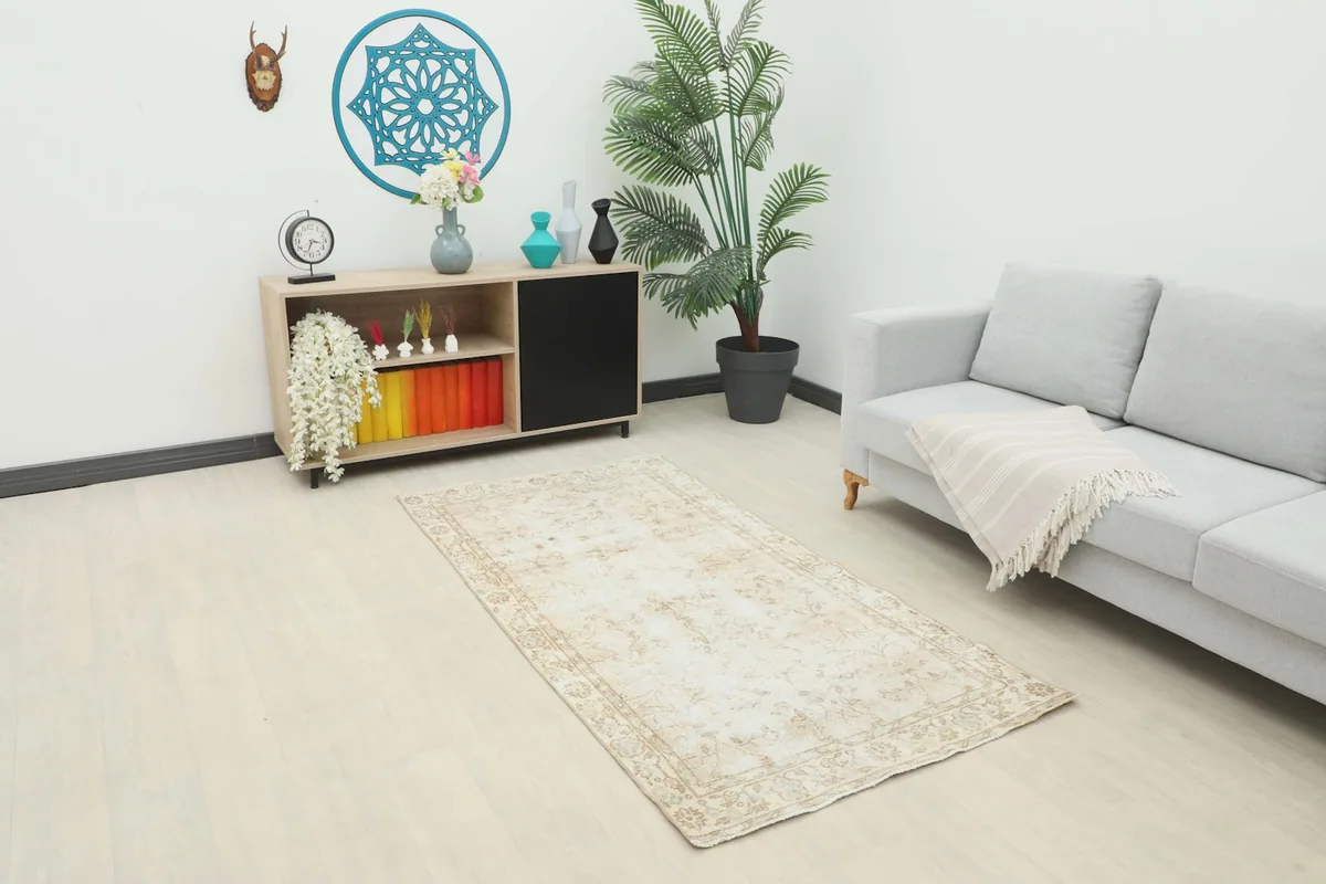 Area rug in a modern living space with a light sofa and wooden furniture.