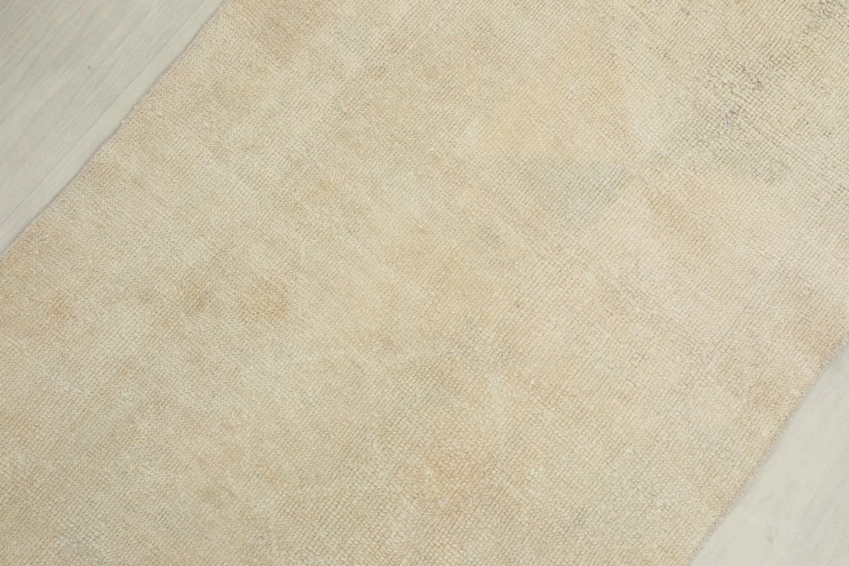 Diagonal close-up view of the runner's surface, showing natural wool texture