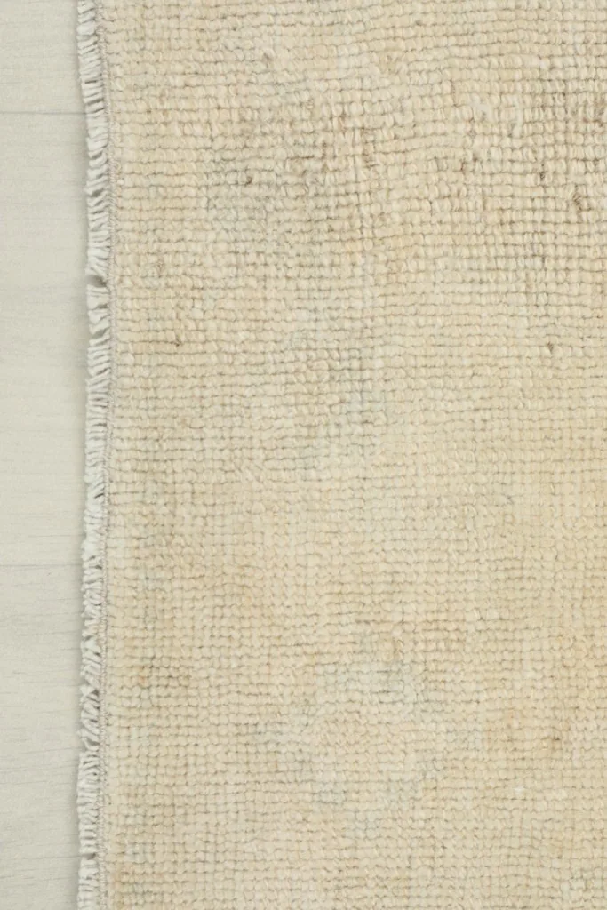 Close-up of the reverse side of the runner, showing the cotton foundation and knotting