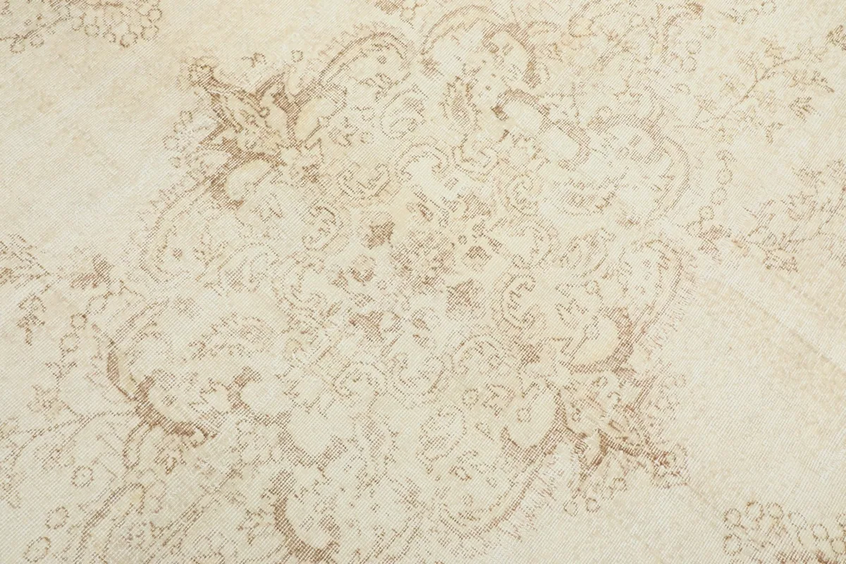 Detailed close-up of the central medallion and surrounding floral motifs