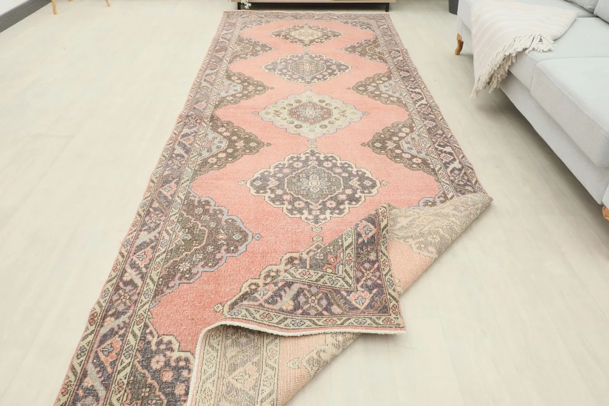 View showing the low pile and texture of the hand-knotted wool rug