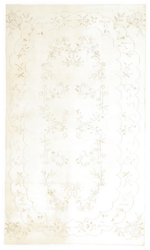 Full overhead view of the 6x10 ivory floral vintage Anatolian rug on a white background