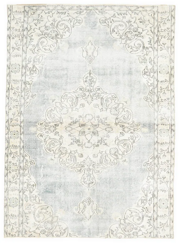 Full overhead view of the hand-knotted vintage Anatolian rug with a faded gray medallion