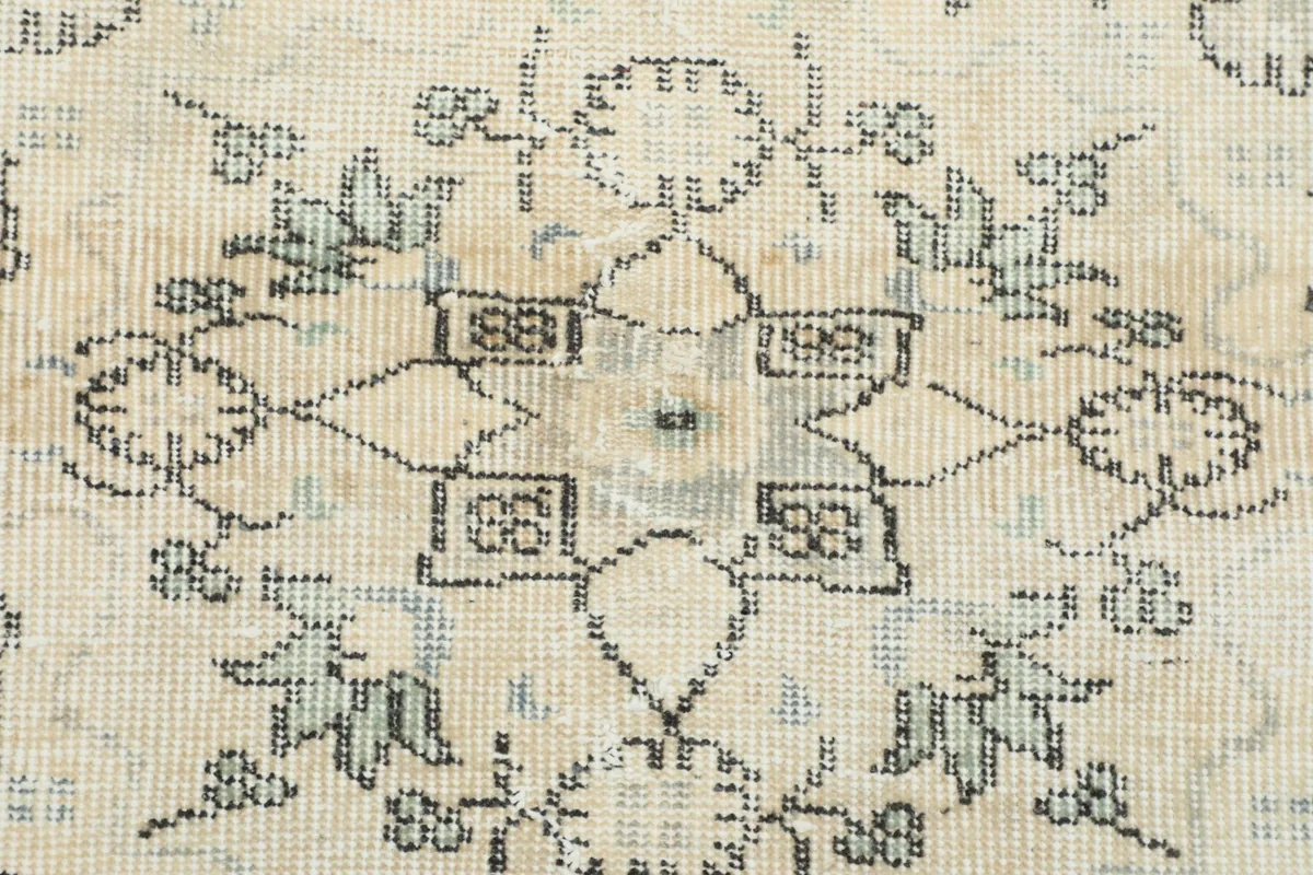 Close-up showing the intricate knotting and subtle color variations within the rug's pattern